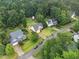 An aerial view of the neighborhood features lush greenery and well-maintained homes at 3916 Rustic Mill Dr, Apex, NC 27539
