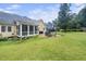 Well-manicured lawn and lush greenery with an outdoor patio and comfortable seating at 3916 Rustic Mill Dr, Apex, NC 27539