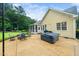 Large backyard with a patio, hot tub, and outdoor seating; perfect for entertaining guests and enjoying the outdoors at 3916 Rustic Mill Dr, Apex, NC 27539