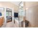 Bright bathroom with a glass enclosed shower, a jetted soaking tub, and a neutral color scheme at 3916 Rustic Mill Dr, Apex, NC 27539