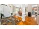 Open foyer featuring slate floors and an adjacent dining room with wooden floors and a bright window at 3916 Rustic Mill Dr, Apex, NC 27539