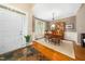 Open foyer featuring slate floors and an adjacent dining room with wooden floors and a bright window at 3916 Rustic Mill Dr, Apex, NC 27539