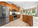 The kitchen features stainless steel appliances, granite countertops, and ample cabinet space for convenient food preparation at 3916 Rustic Mill Dr, Apex, NC 27539