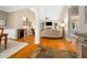 Bright living room with a cozy sofa, hardwood floors, and white pillars, blending elegance and comfort at 3916 Rustic Mill Dr, Apex, NC 27539
