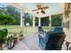 Cozy screened porch with ample seating and a view of the backyard at 3916 Rustic Mill Dr, Apex, NC 27539