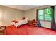 Comfortable bedroom featuring red carpet and a window with natural light at 4272 Boyd Wright Rd, Burlington, NC 27215
