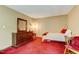 Cozy bedroom featuring red carpet and furniture at 4272 Boyd Wright Rd, Burlington, NC 27215