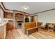 Cozy kitchen area featuring wood cabinets, stainless steel appliances, and wood flooring at 4272 Boyd Wright Rd, Burlington, NC 27215