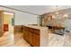 Spacious kitchen features wood cabinets, stainless appliances, a brick cooking area and wood flooring at 4272 Boyd Wright Rd, Burlington, NC 27215