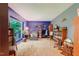 Spacious living room with blue accent walls, large window, and ample seating at 4272 Boyd Wright Rd, Burlington, NC 27215