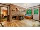 Inviting living room featuring a cozy fireplace, wood accents, and a scenic view from the window at 4272 Boyd Wright Rd, Burlington, NC 27215