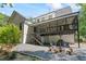 Expansive backyard featuring a screened-in porch, fire pit, grill and chairs at 4408 Queenstown Ct, Raleigh, NC 27612