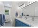 Bathroom includes double vanity, large mirror, and tiled shower/tub at 4408 Queenstown Ct, Raleigh, NC 27612