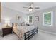 Bedroom with ceiling fan and natural light from dual windows at 4408 Queenstown Ct, Raleigh, NC 27612