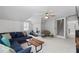 Large bonus room with comfortable sofa, exercise equipment, and carpet flooring at 4408 Queenstown Ct, Raleigh, NC 27612