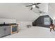 Finished bonus room offers a wet bar with wine fridge, built-in shelving and bench seat at 4408 Queenstown Ct, Raleigh, NC 27612