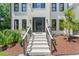 Close up of front porch with freshly painted brick steps leading to a black modern front door at 4408 Queenstown Ct, Raleigh, NC 27612