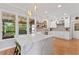 Stylish kitchen featuring a quartz island, stainless appliances, pendant lights and outdoor views at 4408 Queenstown Ct, Raleigh, NC 27612