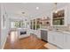 Bright kitchen features a stylish island, stainless steel appliances, and an open floor plan at 4408 Queenstown Ct, Raleigh, NC 27612