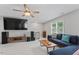 Bright living room with plush seating, entertainment center, and backyard views at 4408 Queenstown Ct, Raleigh, NC 27612