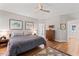 Spacious main bedroom with hardwood floors, ceiling fan, and natural light at 4408 Queenstown Ct, Raleigh, NC 27612