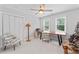 Bright office space includes a ceiling fan, large desk, and views to the backyard at 4408 Queenstown Ct, Raleigh, NC 27612
