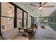 Relaxing screened porch with stylish furniture, ceiling fans, and a view of the backyard at 4408 Queenstown Ct, Raleigh, NC 27612