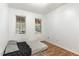 Modest bedroom featuring wood floors, white walls, and natural light from two windows overlooking a deck at 4575 Wendell Blvd, Wendell, NC 27591