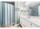 Bathroom featuring a vanity, patterned walls, and blue shower curtain at 46 Sparger Springs Ln, Durham, NC 27705