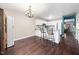 Charming kitchen featuring a breakfast bar, dining area, with hardwood floors, and ample counter space at 46 Sparger Springs Ln, Durham, NC 27705