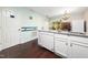 Modern kitchen boasts a large sink, granite countertops, white cabinets, and stainless steel appliances at 46 Sparger Springs Ln, Durham, NC 27705