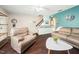 Inviting living room features hardwood floors, stairs, and comfortable seating with nice decor at 46 Sparger Springs Ln, Durham, NC 27705