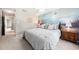 Comfortable bedroom featuring cozy carpet, neutral decor and a mural accent wall at 46 Sparger Springs Ln, Durham, NC 27705