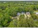 Aerial view showcasing a neighborhood with tree-lined streets and well-maintained homes at 4705 Royal Troon Dr, Raleigh, NC 27604