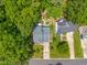 Aerial view of a home with mature trees and driveway at 4705 Royal Troon Dr, Raleigh, NC 27604
