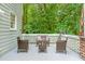 Relaxing back porch with outdoor seating, offering a peaceful view of the surrounding greenery at 4705 Royal Troon Dr, Raleigh, NC 27604