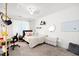 Well-lit bedroom boasts a decorative bed, a functional workspace, and ample storage solutions at 4705 Royal Troon Dr, Raleigh, NC 27604