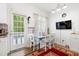 Bright breakfast nook featuring a white table, chairs, and a view to the backyard at 4705 Royal Troon Dr, Raleigh, NC 27604