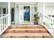 Charming front entrance with brick steps, decorative wreath, and a welcome sign at 4705 Royal Troon Dr, Raleigh, NC 27604