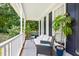 Cozy front porch with comfortable seating and decorative plants at 4705 Royal Troon Dr, Raleigh, NC 27604