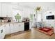 Eat-in kitchen with white cabinets, modern appliances, and stylish backsplash at 4705 Royal Troon Dr, Raleigh, NC 27604
