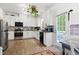 Well-lit kitchen featuring stainless steel appliances, ample storage, and a breakfast nook at 4705 Royal Troon Dr, Raleigh, NC 27604