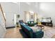 Sunlit living area with vaulted ceiling, showcasing couches and entertainment center at 4705 Royal Troon Dr, Raleigh, NC 27604
