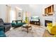 Bright living room featuring a fireplace, TV, and comfortable seating arrangements at 4705 Royal Troon Dr, Raleigh, NC 27604