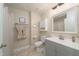 Neat bathroom featuring a vanity with gray cabinets, a toilet, and a shower with a curtain at 4710 Rollingwood Dr, Durham, NC 27713