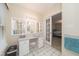 Bright bathroom featuring a vanity area with ample lighting and storage at 4710 Rollingwood Dr, Durham, NC 27713