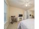 Well-lit bedroom with a full bed, a desk, and comfortable seating area at 4710 Rollingwood Dr, Durham, NC 27713