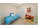 Cozy bedroom with playful decor, featuring a twin bed and colorful accents at 4710 Rollingwood Dr, Durham, NC 27713
