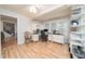 A home office with built-in shelving, laminate floors, and a large window with natural light at 4710 Rollingwood Dr, Durham, NC 27713