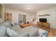 Bright living room with hardwood floors, comfortable seating, and sliding glass door at 4710 Rollingwood Dr, Durham, NC 27713